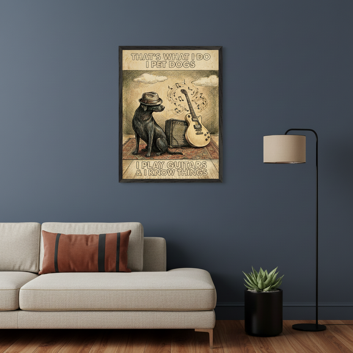 Modern living room with a beige sofa. A framed sketch-style poster hangs above the sofa, featuring a black dog in a fedora, an electric guitar, and music notes. Text reads: "THAT'S WHAT I DO I PET DOGS I PLAY GUITARS & I KNOW THINGS."