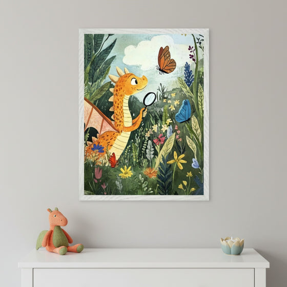 Kid's room with a white dresser. Above it, a framed illustration shows an orange dragon with a magnifying glass examining butterflies in a vibrant, flowery garden. A plush dragon toy and a decorative candle sit on the dresser.
