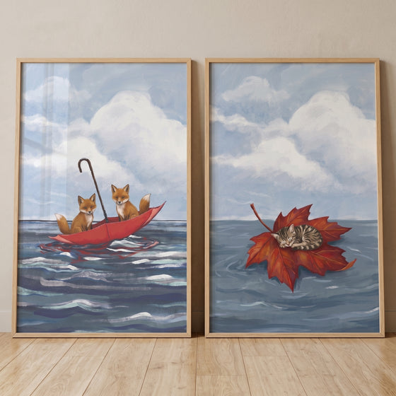 Foxes in a red umbrella and a kitten on a leaf in this dreamy blue ocean animals wall art set of 2.