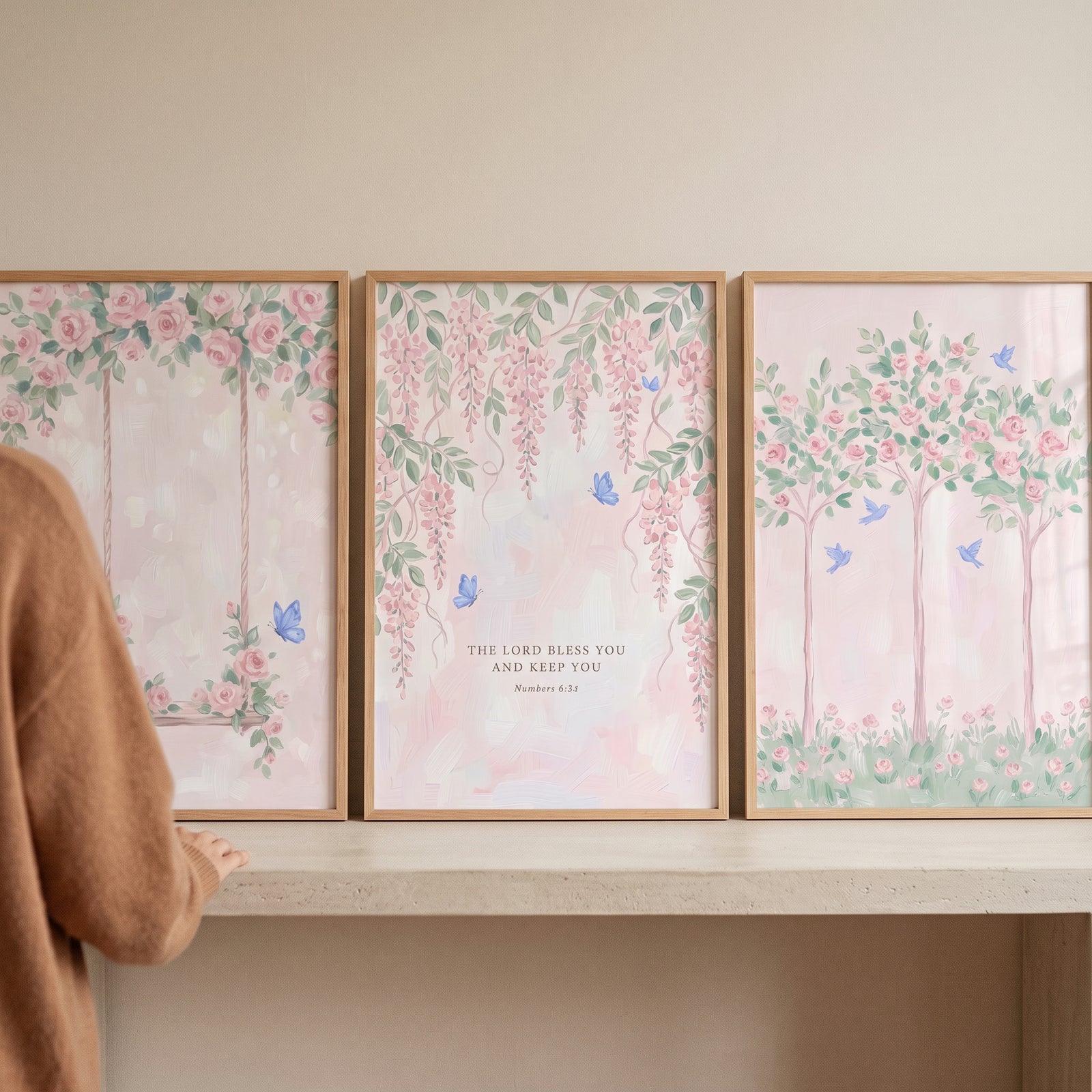 Dreamy blush floral garden wall art set of 3 with pink flowers, blue butterflies, and a Bible verse on a shelf.