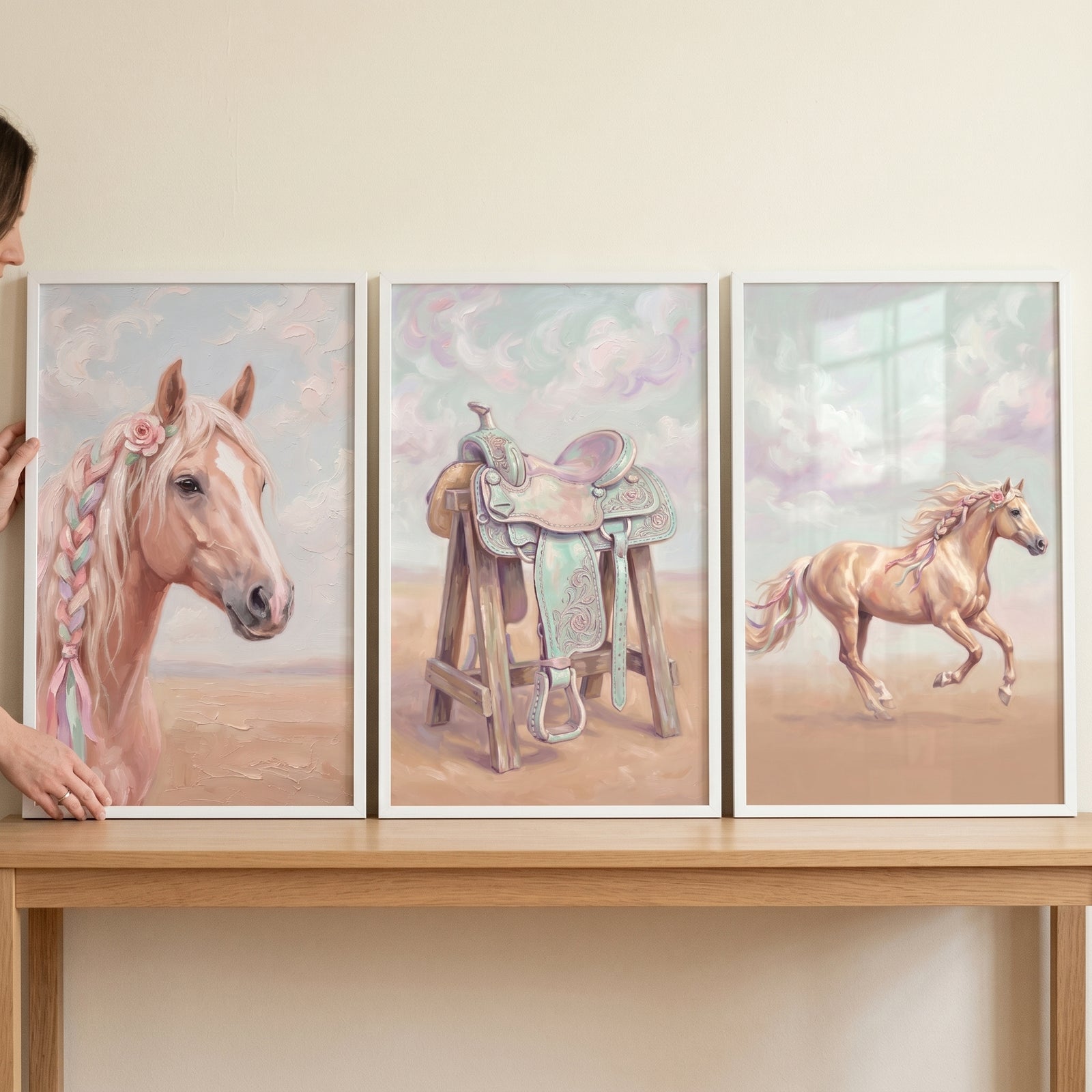 Dreamy floral palomino horse wall art set of 3 with a horse head, a saddle, and a running horse on a wooden table.
