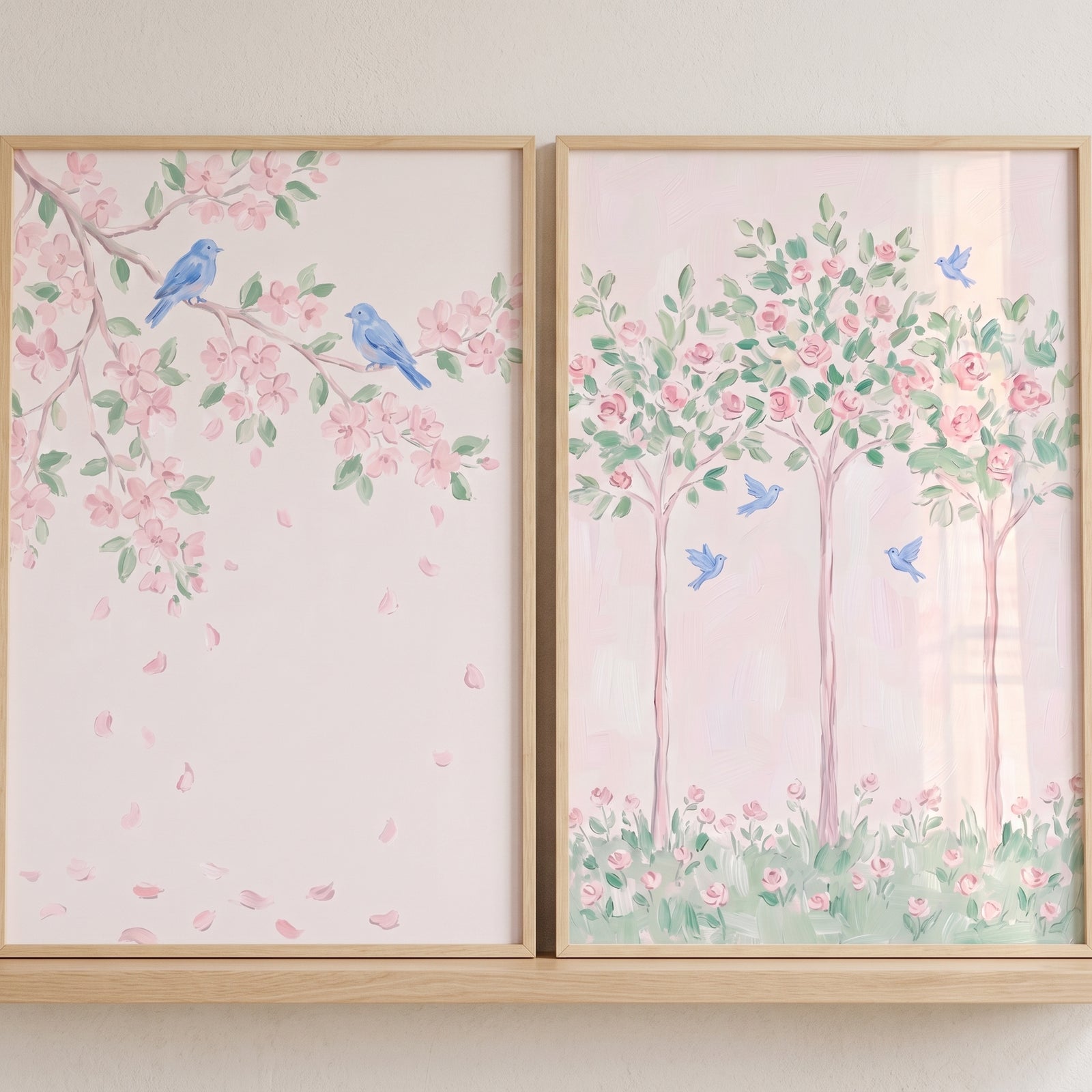 Dreamy garden blue bird wall art set of 2 with soft pink blossoms and blue birds in light wood frames.