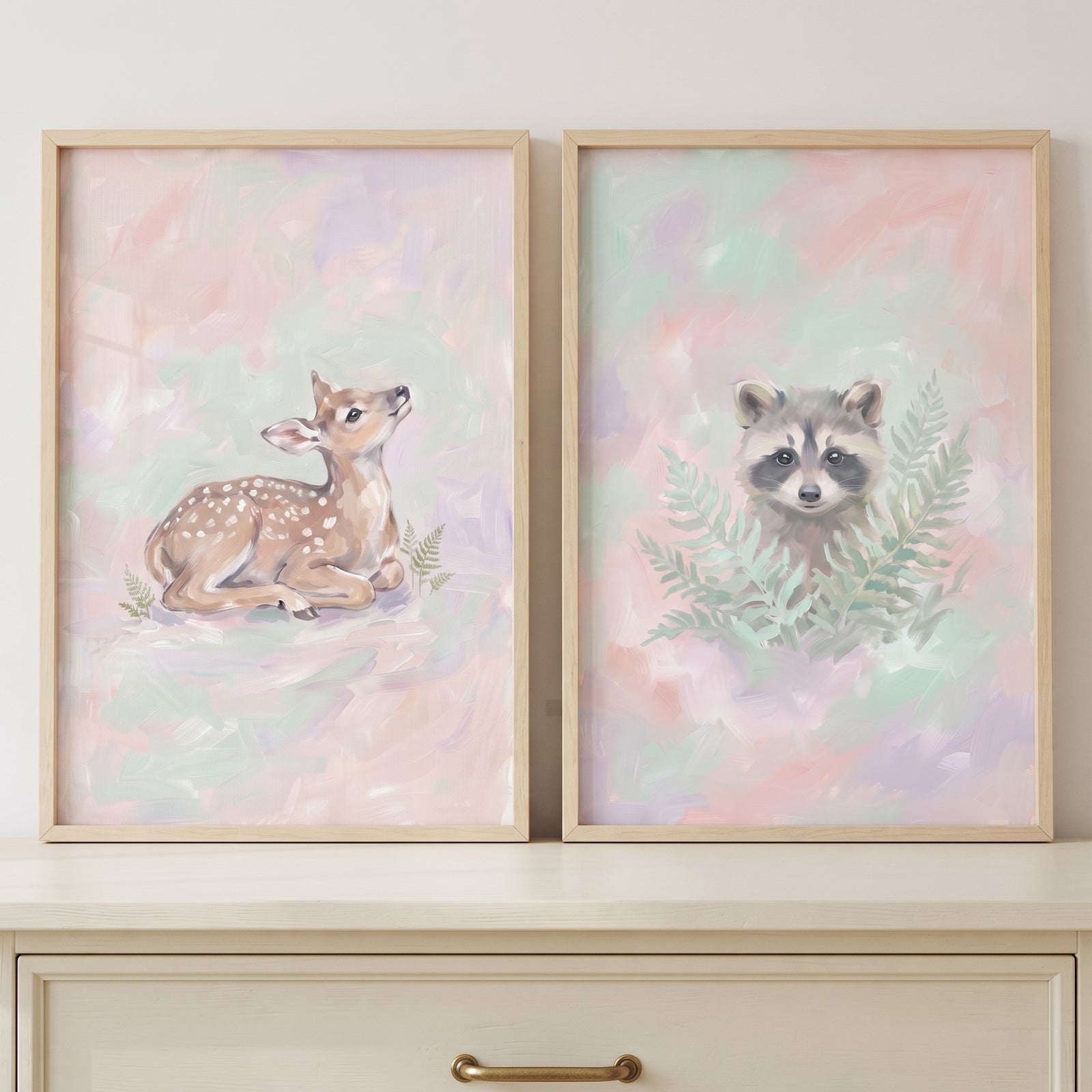 Dreamy impressionist forest animal wall art set of 2 featuring a fawn and a raccoon in soft pastel colors.