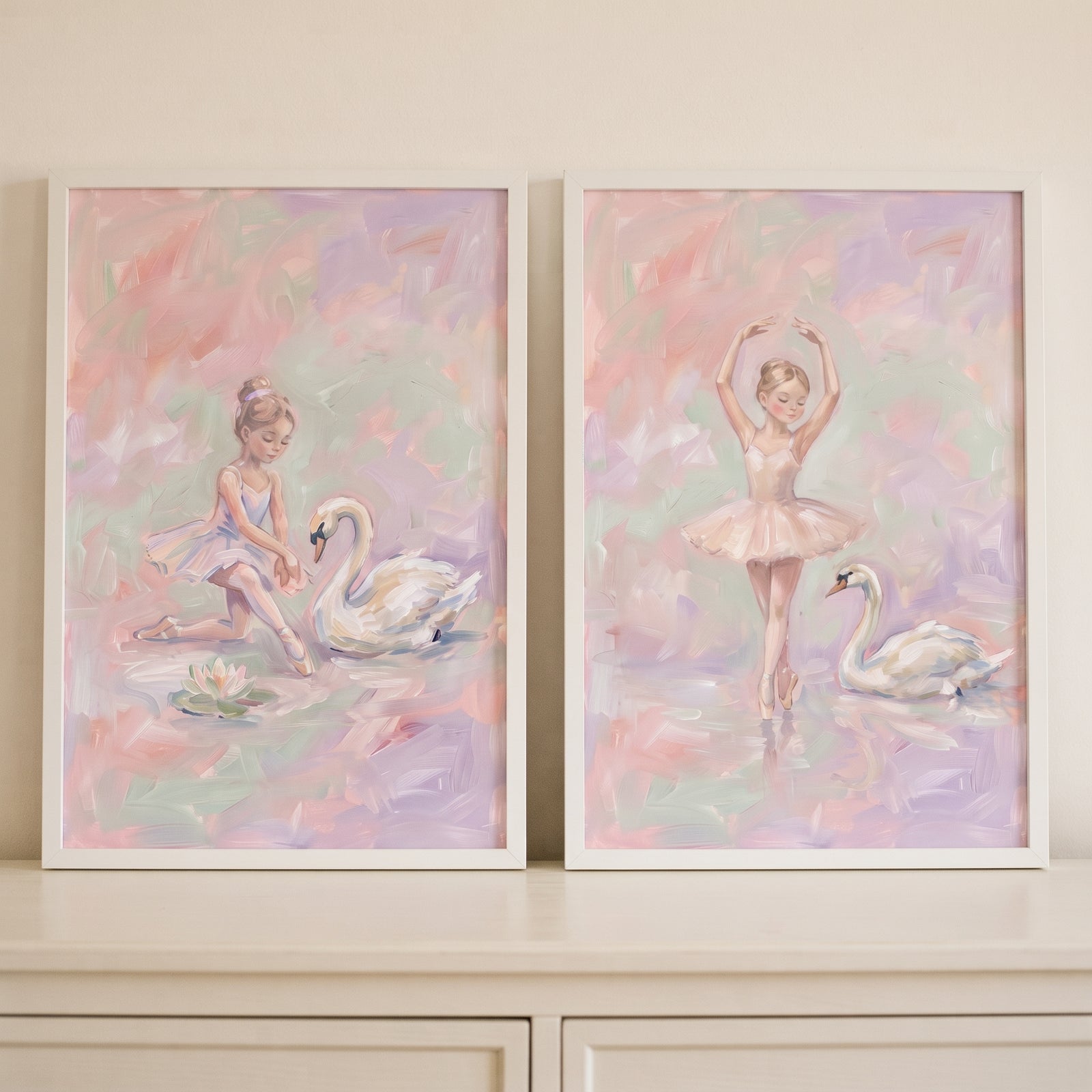 Dreamy impressionist swan ballet wall art set of 2 with a ballerina and swan in soft pink and purple hues.