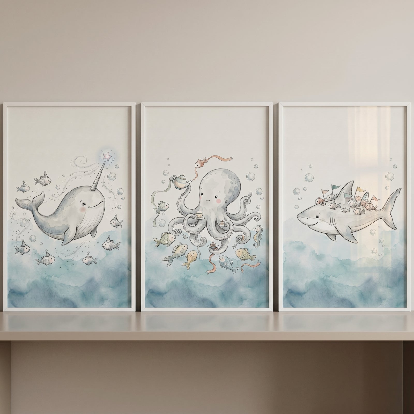 Dreamy nautical sea animal wall art set of 3 featuring a whimsical narwhal, octopus, and shark in white frames.