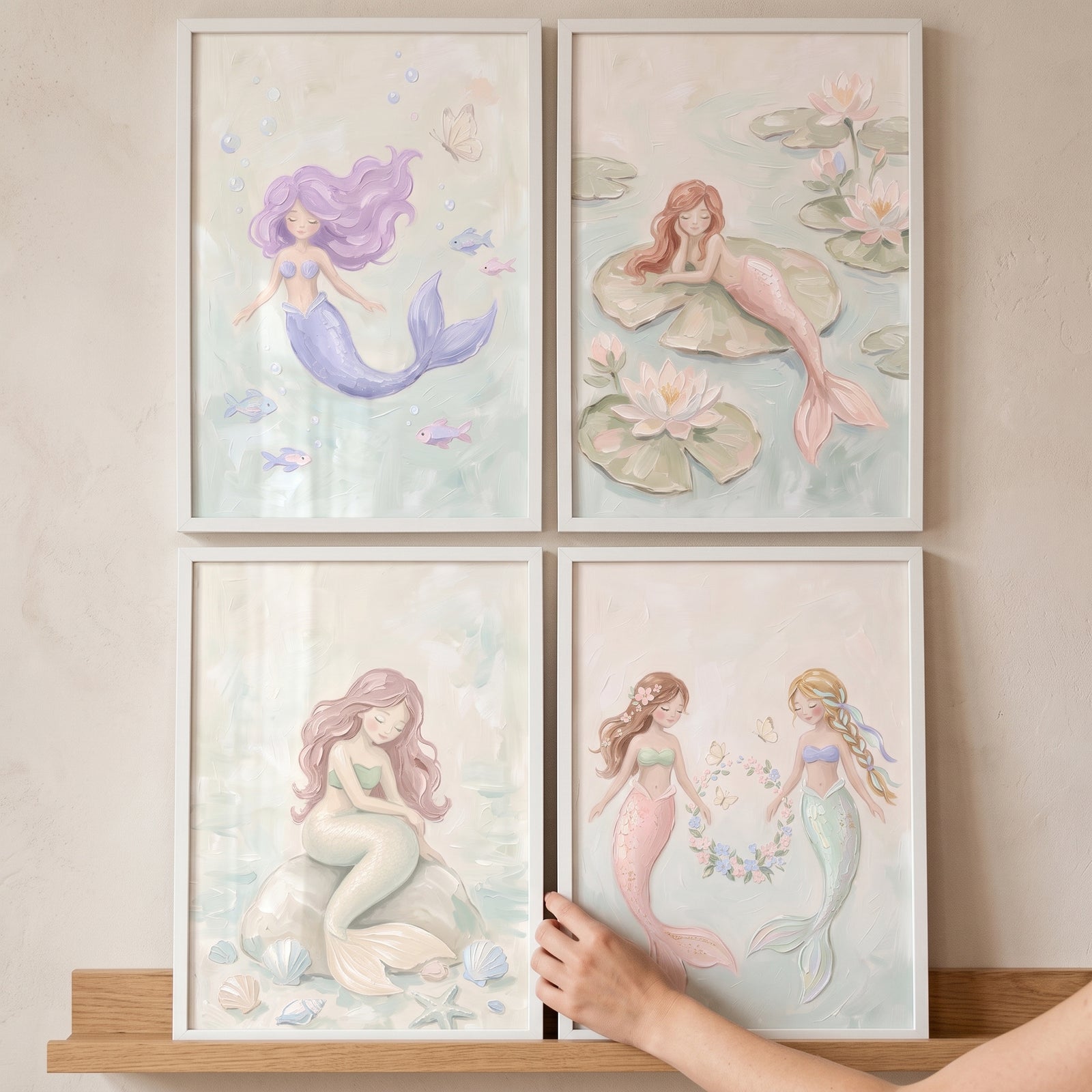 Dreamy pastel watercolor mermaid wall art set of 4 framed prints showing whimsical mermaids in a soft underwater theme.