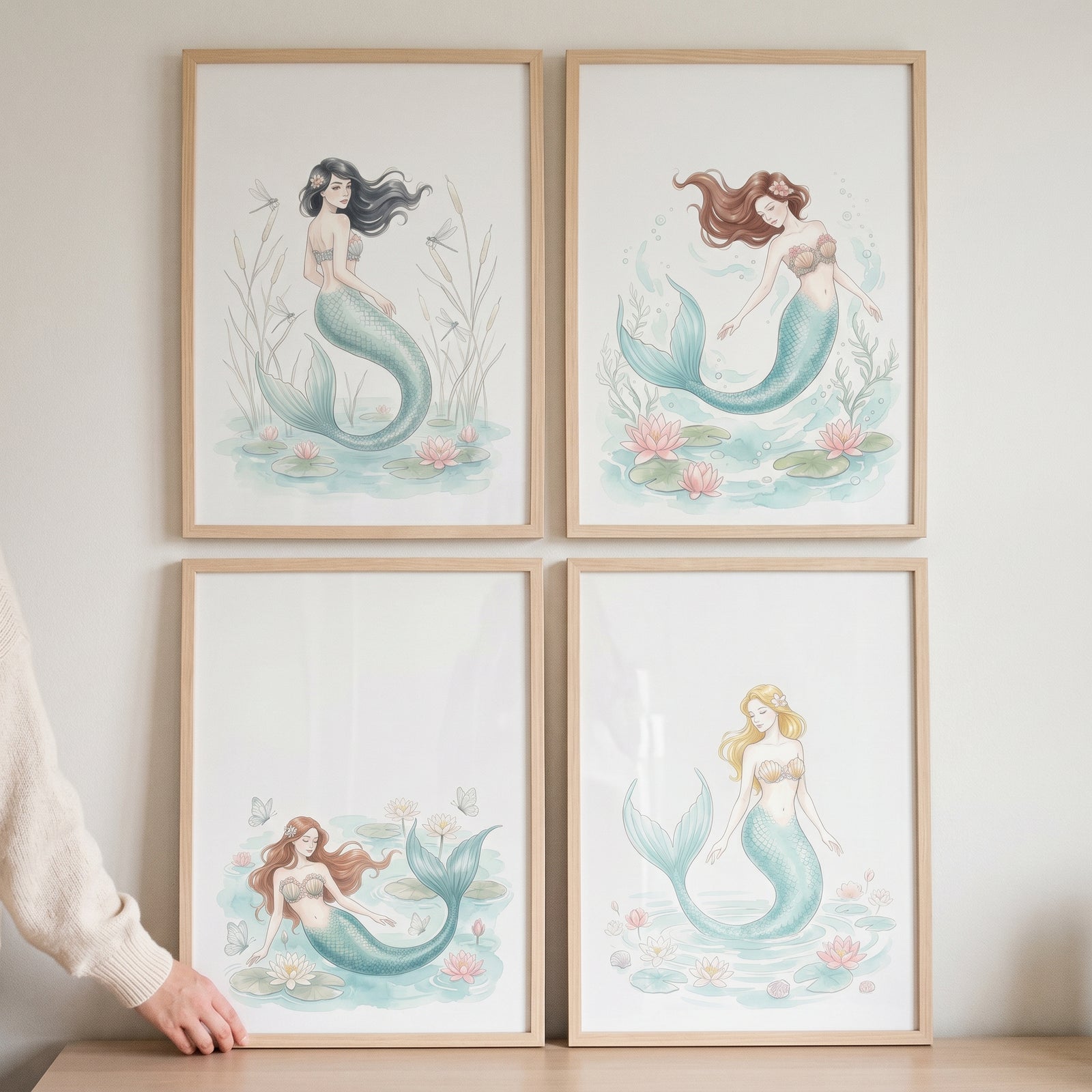 Dreamy watercolor botanical mermaid wall art set of 4 featuring various mermaids among water lilies in wooden frames.