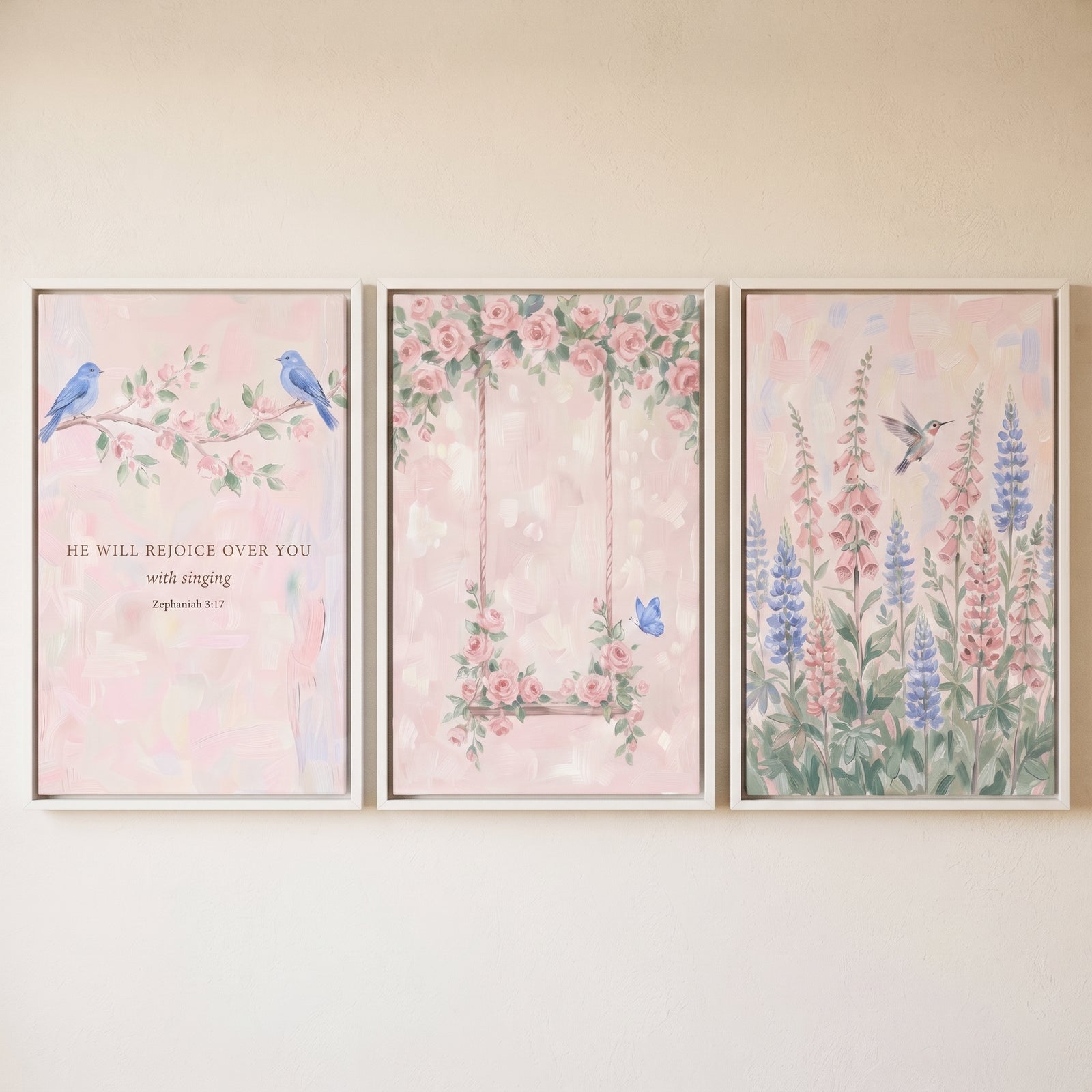 Dreamy watercolor flower garden wall art set of 3 with blue birds, a rose-covered swing, and tall pink and blue flowers.
