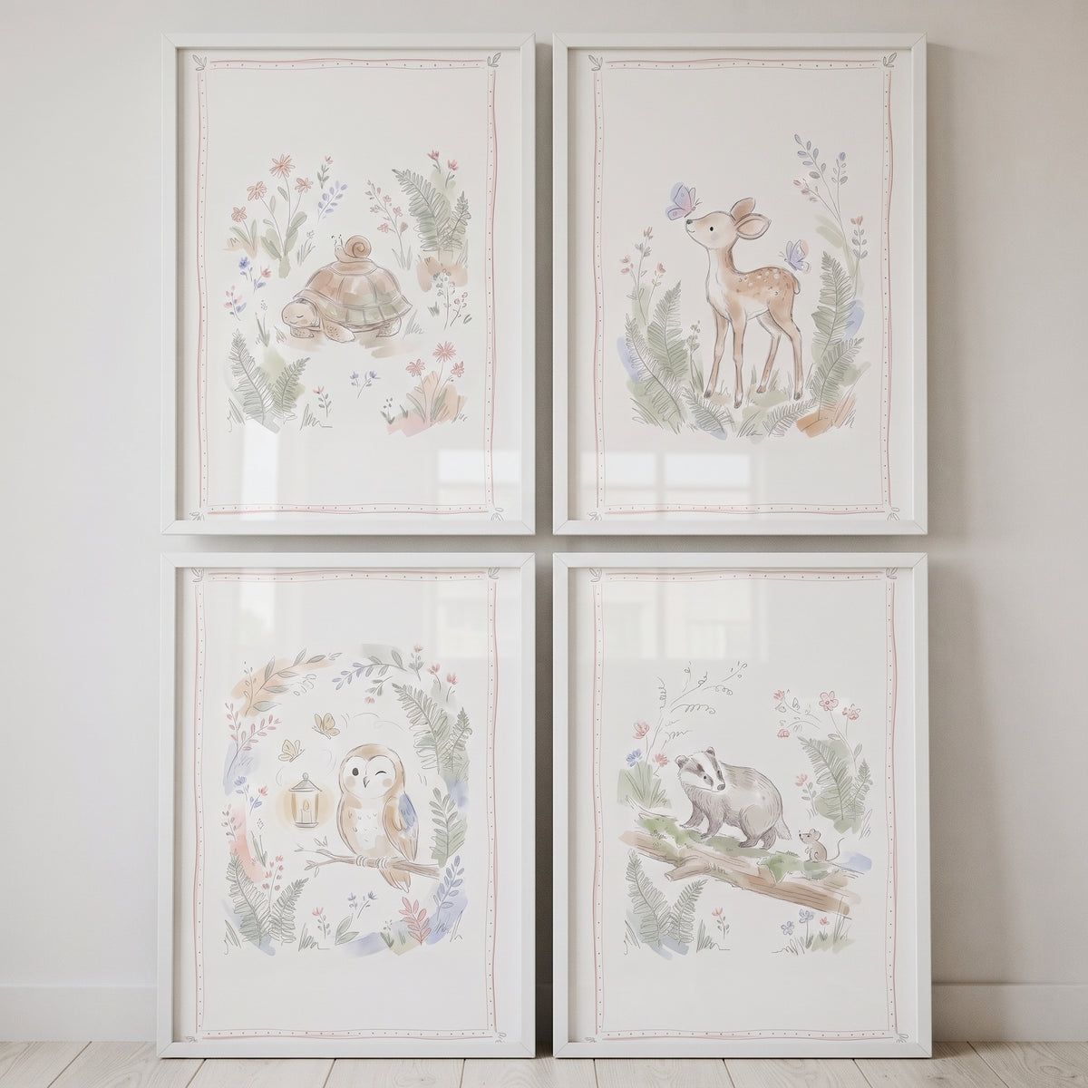 Dreamy watercolor forest animal wall art set of 4 featuring a turtle, deer, owl, and badger in white frames.