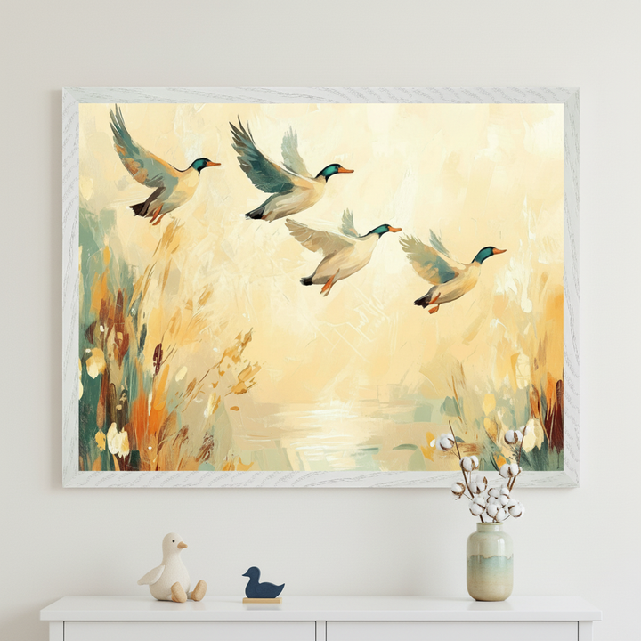 Modern room with a white dresser. A large framed painterly artwork of four flying ducks above wetlands and water hangs centered over the dresser. Duck figurines and cotton branches in a vase decorate the dresser.