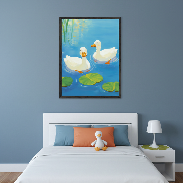 Kid's bedroom with a white bed and nightstand. A framed illustration of two white ducks on a pond with lily pads hangs centered above the bed. Blue walls, blue and orange pillows, and a stuffed duck sit on the bed.