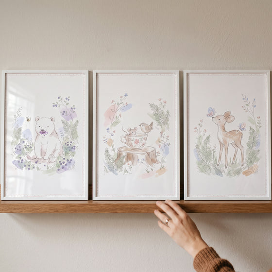 Framed dusty pastel forest animal wall art set of 3 featuring a bear, mouse, bird, and deer on a wooden shelf.