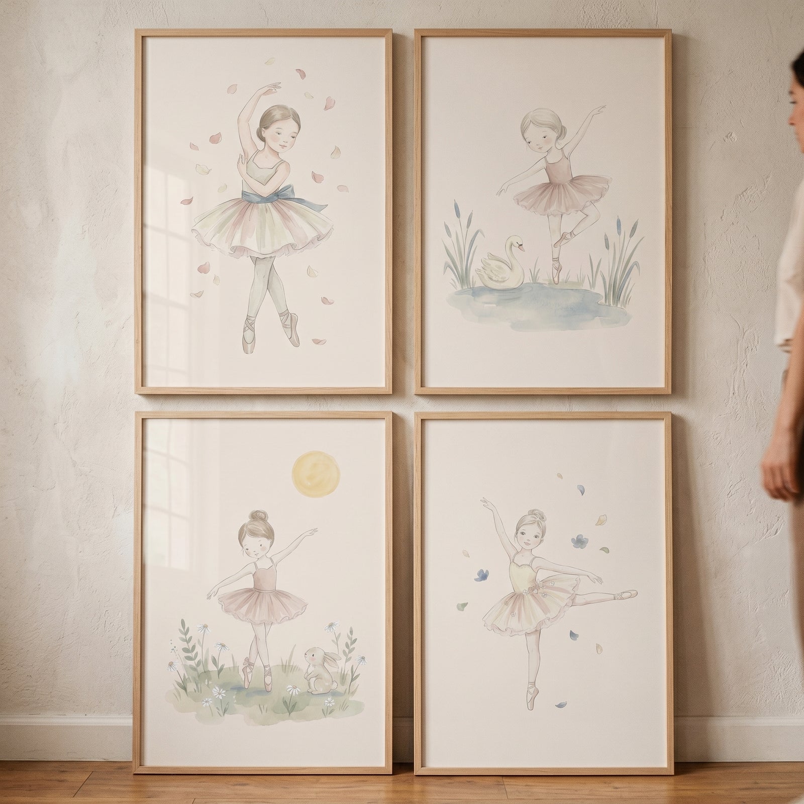 Dusty pink watercolor ballerina wall art set of 4 framed prints of young dancers in tutus with soft nature motifs.