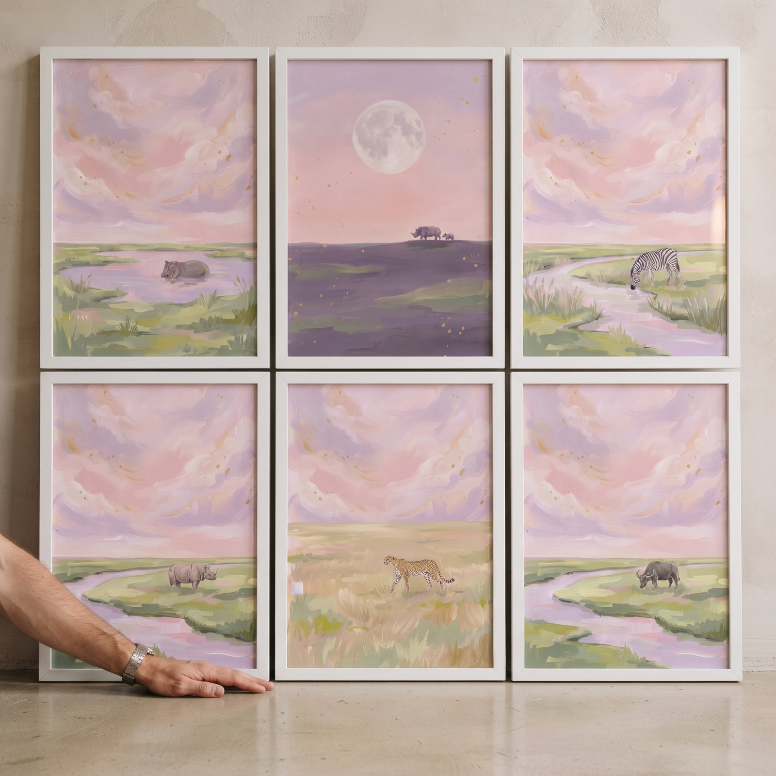 Dusty rose safari animals wall art set of 6 displays wild animals in pastel landscapes under soft pink and purple skies.
