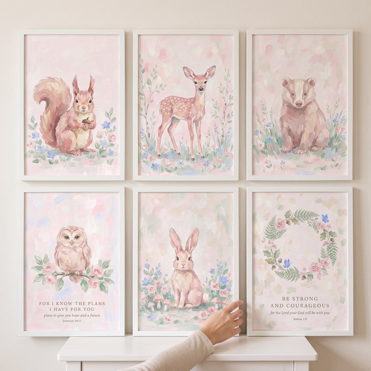 Dusty rose woodland floral wall art set of 6 with soft watercolor animals, a wreath, and scripture in white frames.
