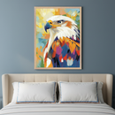 Bedroom with a light upholstered bed and white pillows. A framed, colorful, abstract painting of an eagle is centered above the bed on a blue-gray wall.