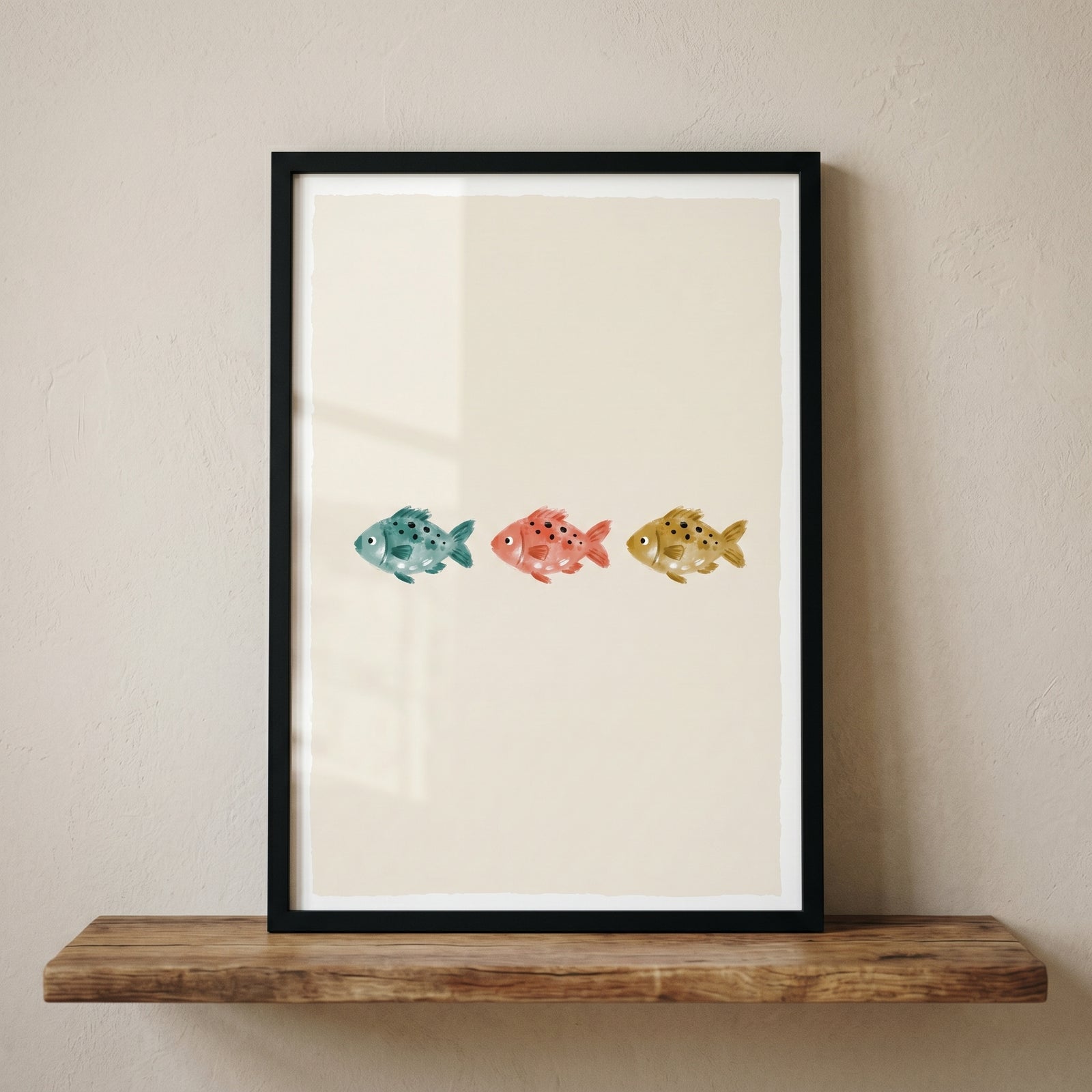 Framed earth tone swimming fish print with teal, coral, and gold fish, displayed on a rustic wooden shelf.