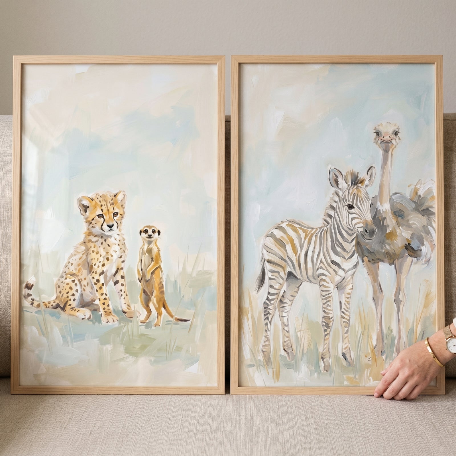 Earthy baby safari animals artwork set of 2 with a cheetah cub, meerkat, zebra foal, and ostrich in muted tones.