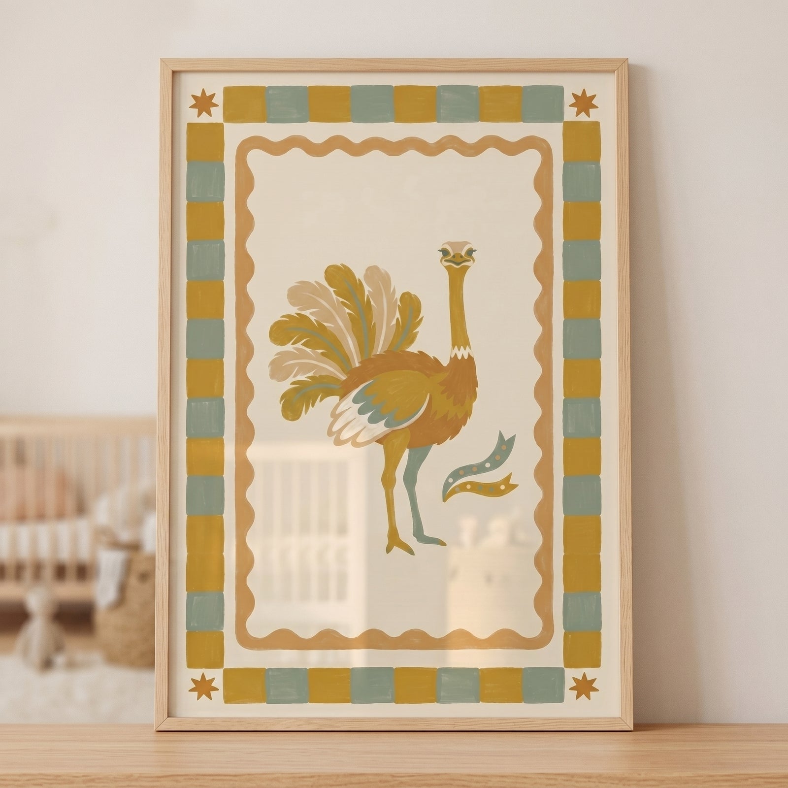 Framed earthy checkered border ostrich wall art in muted yellow and sage tones sits on a wooden shelf in a nursery.