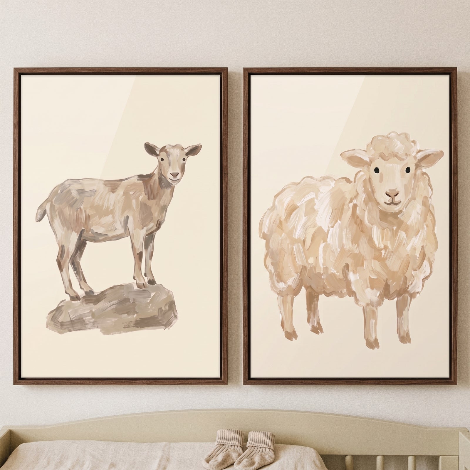 Earthy neutral farm animals wall art set of 2 showing a goat and a sheep in brown wood frames above a light green crib.