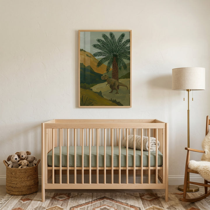 Earthy palm tree t-rex wall art hangs above a light wood crib in a nursery with a floor lamp and rocking chair.