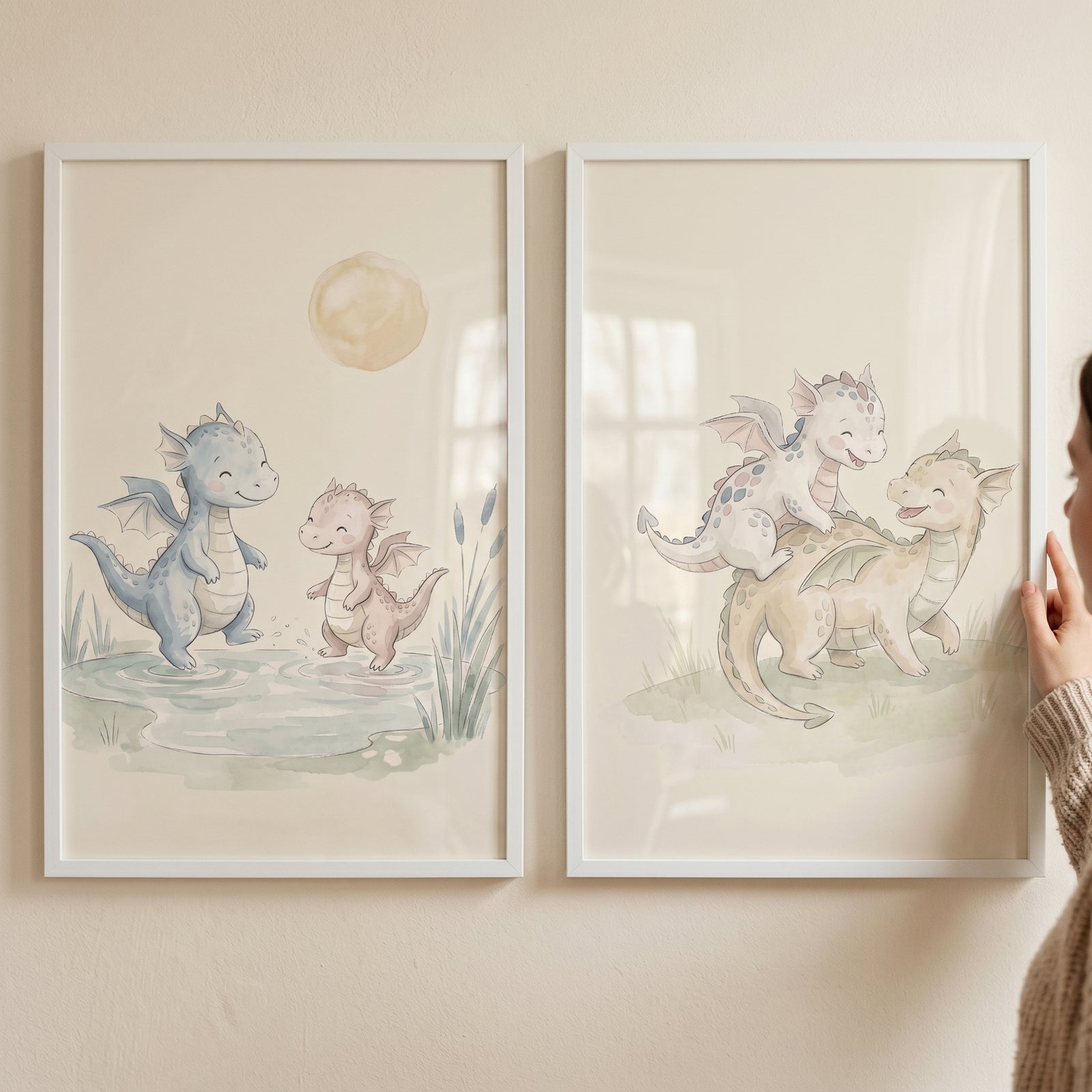 Earthy pastel baby dragons wall art set of 2 with watercolor scenes of cute dragons playing in water and in a field.