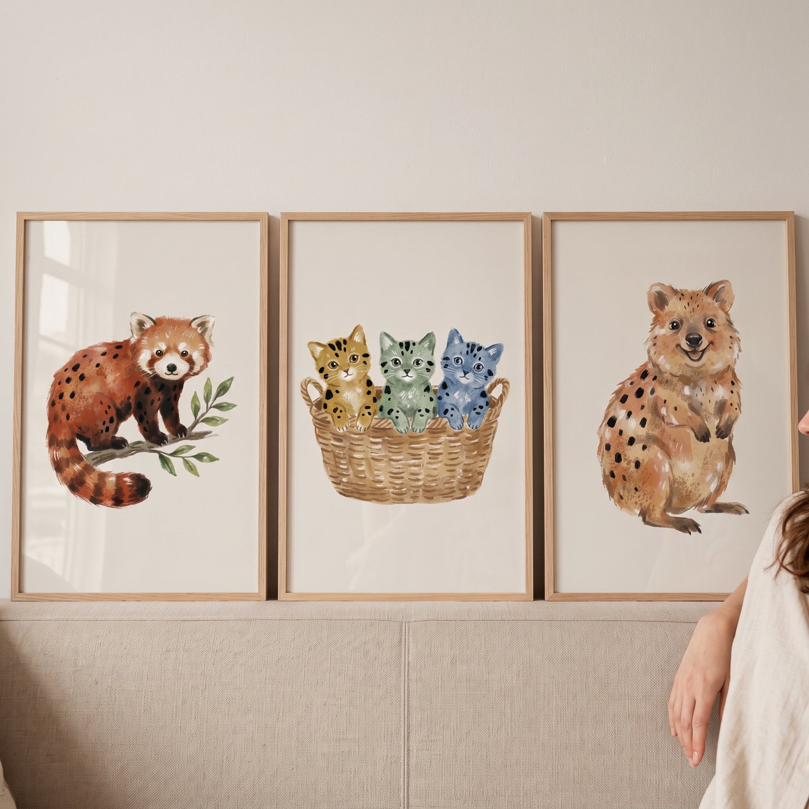 Earthy tone spotted animal wall art set of 3 featuring a red panda, kittens in a basket, and a quokka.