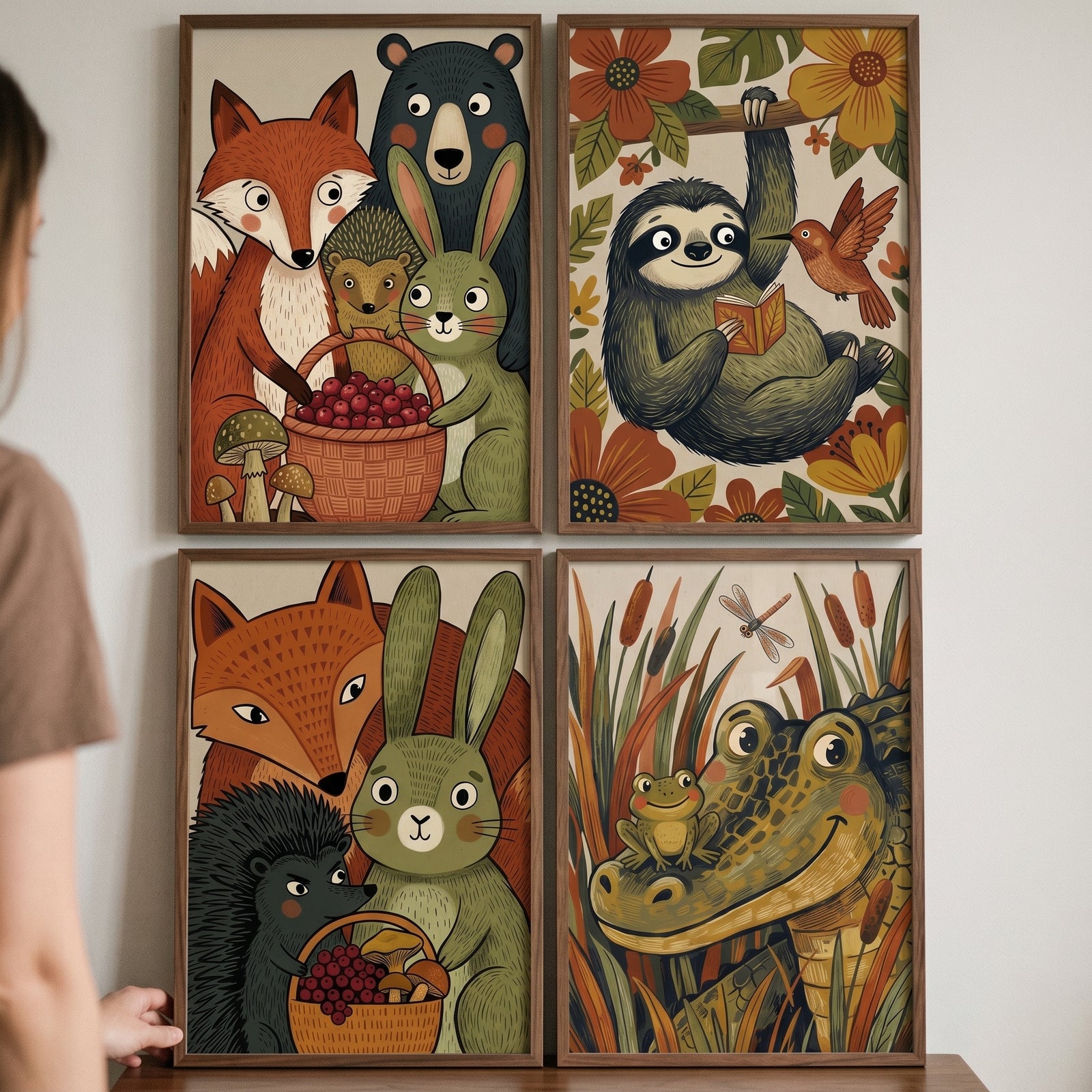 Earthy tone woodland animal wall art set of 4 features illustrated foxes, a bear, a sloth reading, and a crocodile.