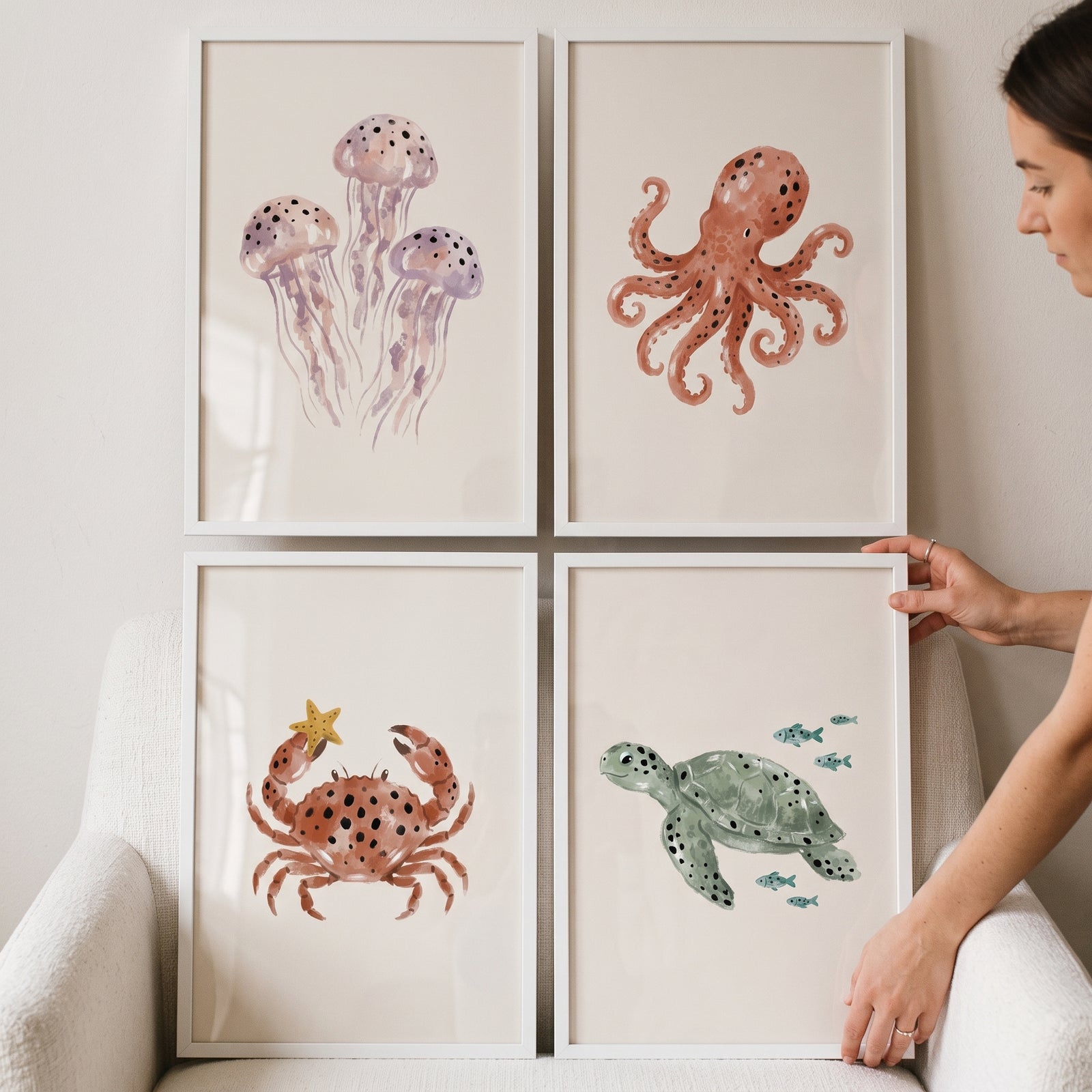 Earthy tones sea animal wall art set of 4 featuring a watercolor jellyfish, octopus, crab, and sea turtle.