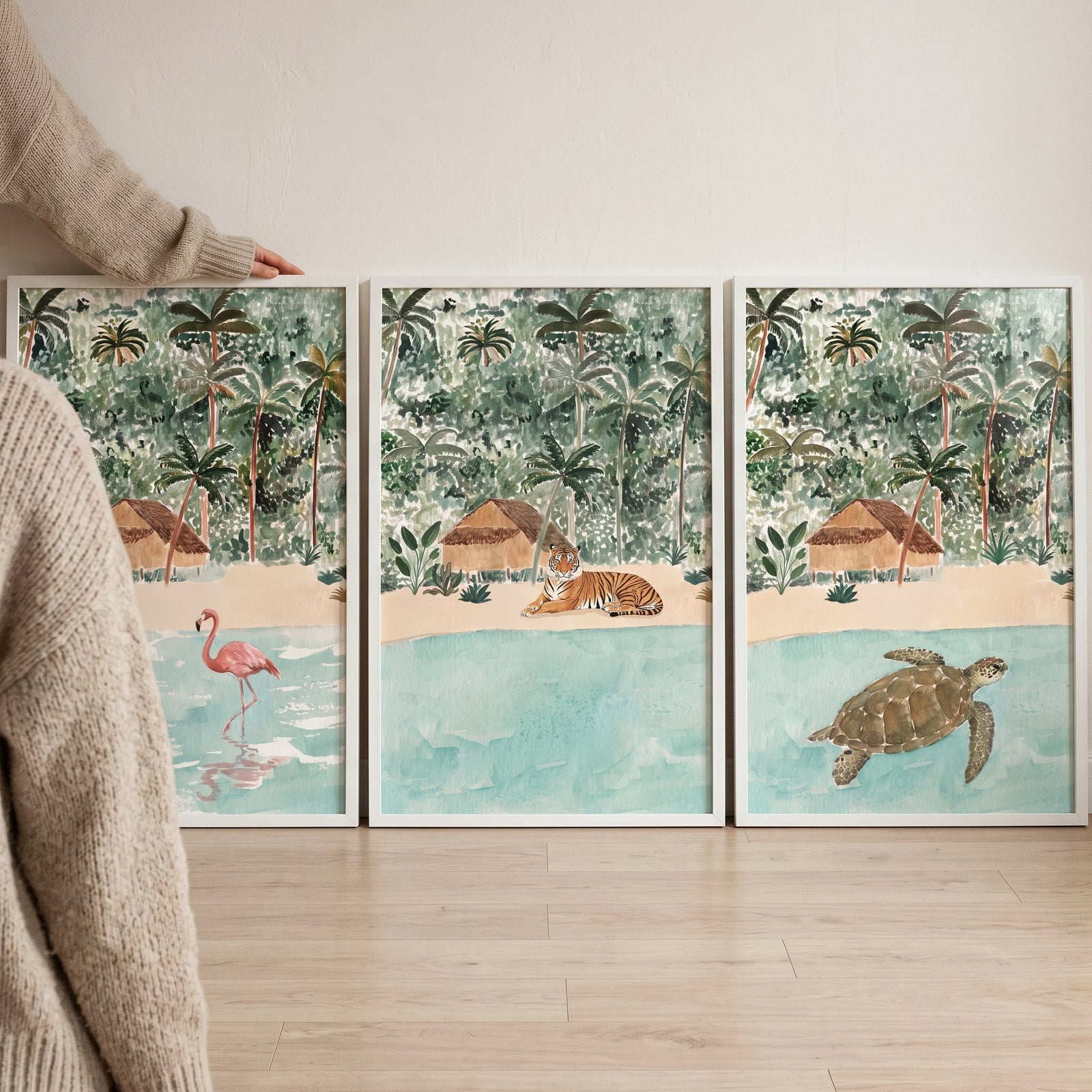 Earthy tones tropical animals wall art set of 3 shows a flamingo, tiger, and turtle in jungle beach landscapes.