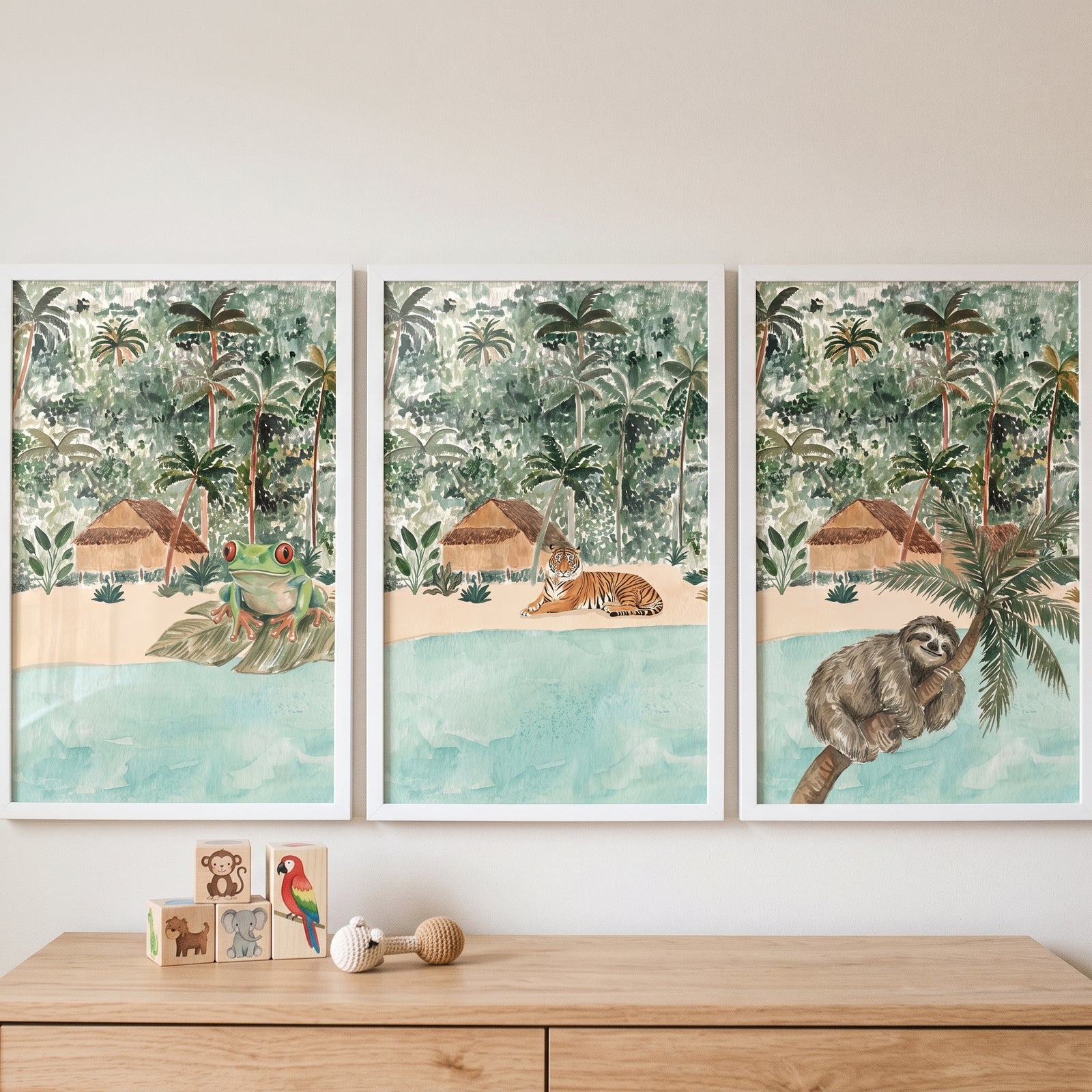 Earthy watercolor jungle animals wall art set of 3 featuring a frog, tiger, and sloth above a dresser.