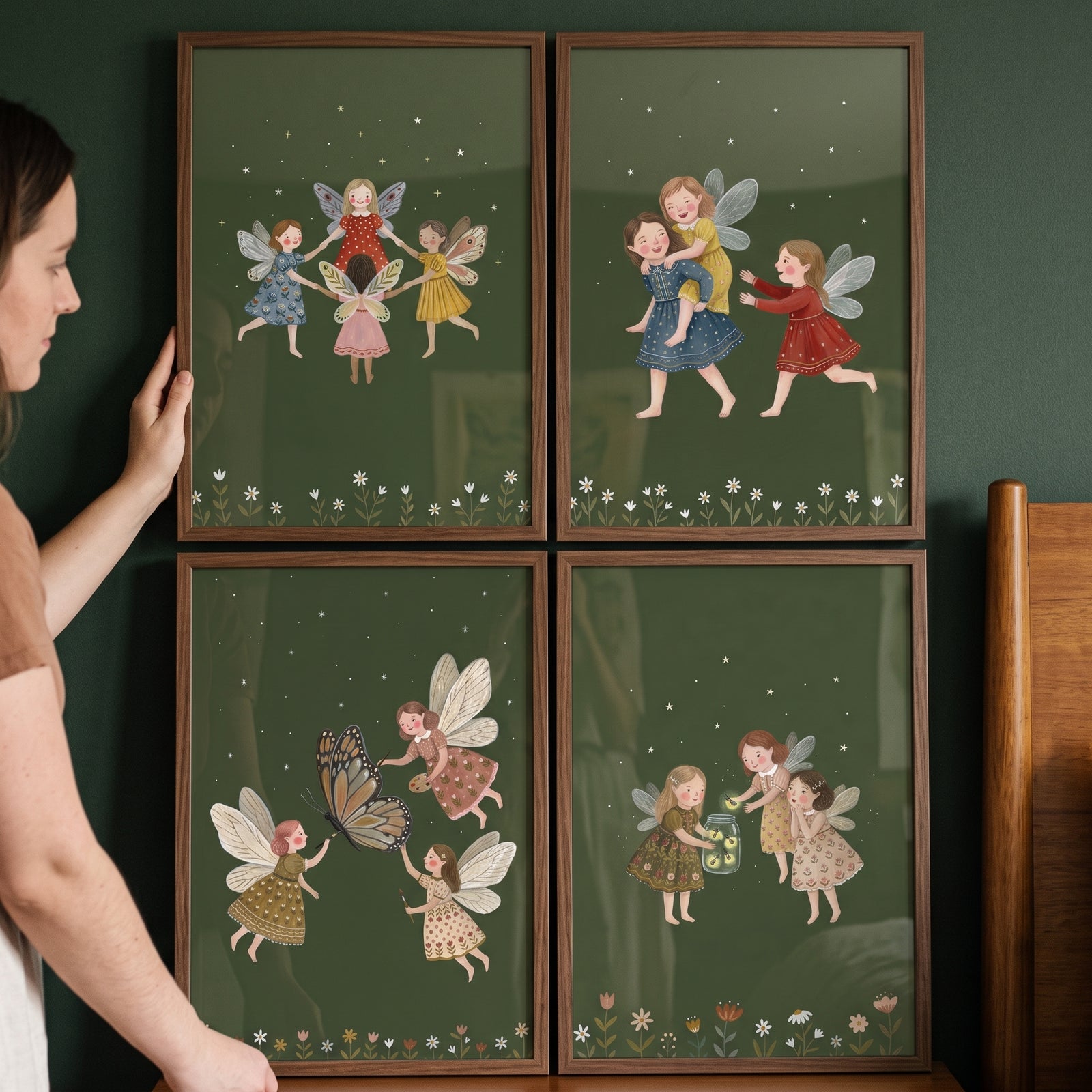 Earthy whimsical folk fairies wall art set of 4 in wooden frames with winged girls on a dark green background.
