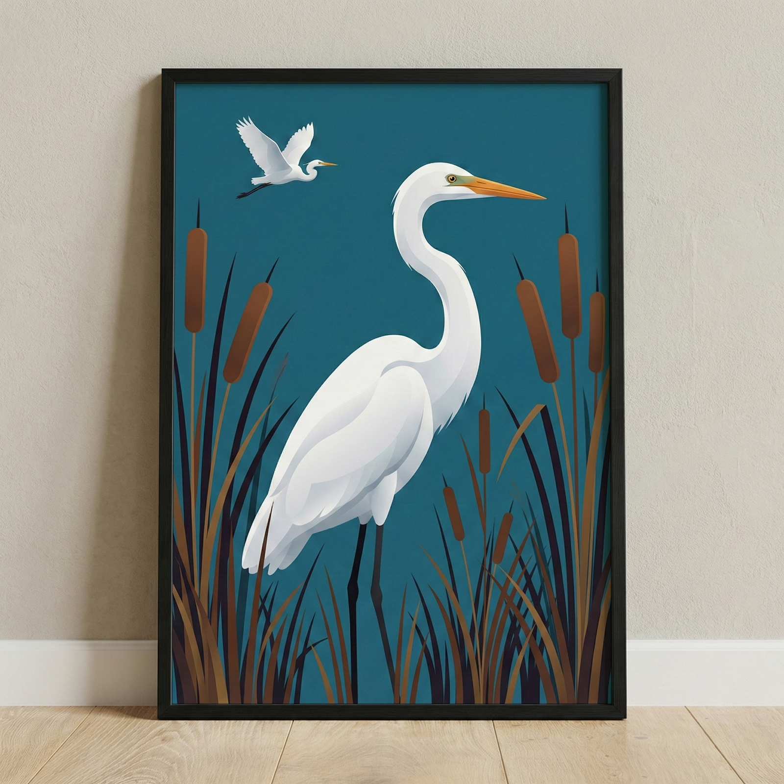 A framed graphic illustration features two white egrets in a stylized marsh setting. In the center, a large egret stands with a long, graceful neck and a pointed orange beak. It is surrounded by tall, brown marsh grasses and several cattails. In the upper left corner, a second, smaller egret is captured in mid-flight. The entire scene is set against a solid, deep teal background. The artwork is held within a simple black frame, which leans against a light-colored wall on a pale wooden floor.