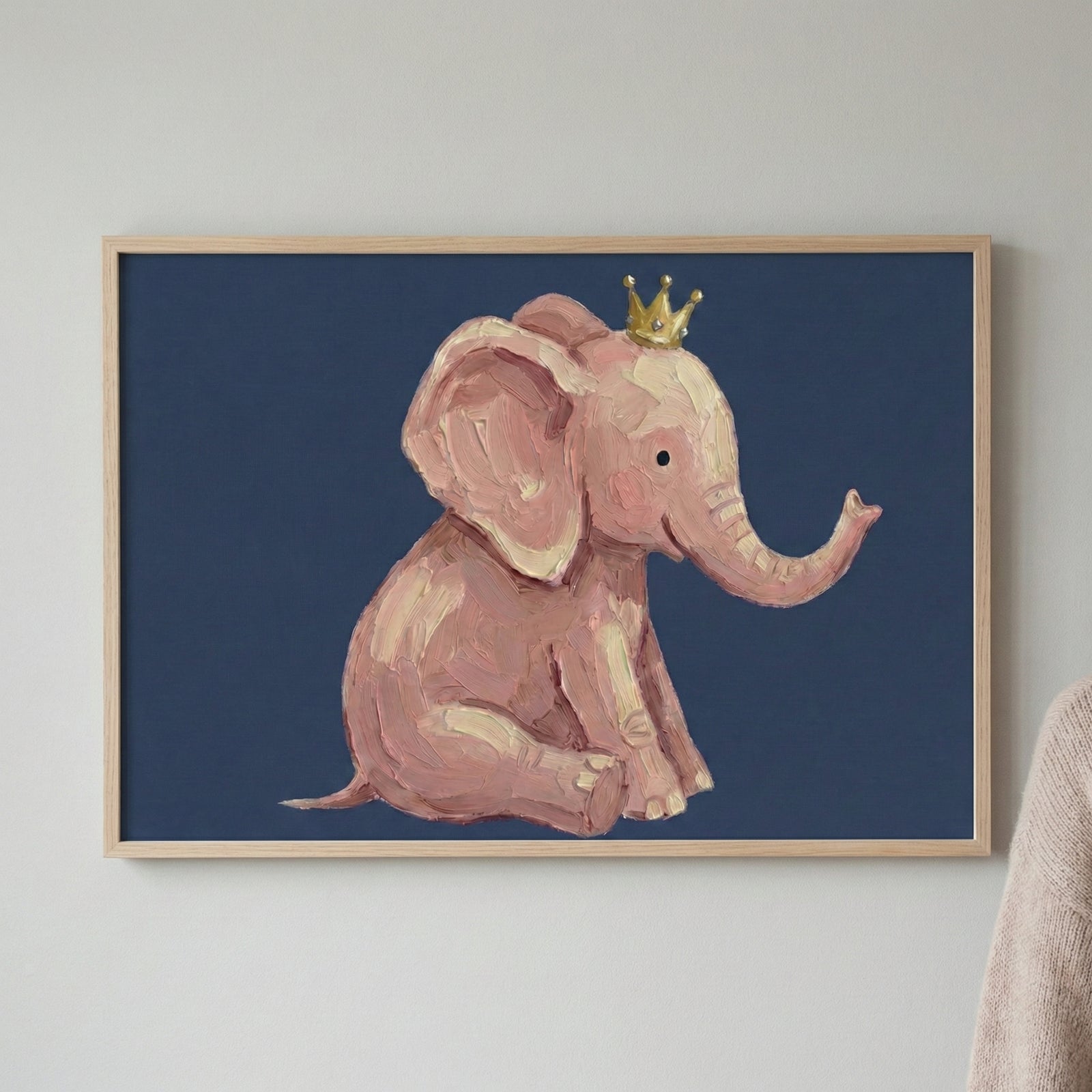 A charming painting of a pink baby elephant wearing a tiny golden crown, set against a navy blue background. The whimsical brushstrokes and warm tones make it a delightful piece for a child's room or playful space.