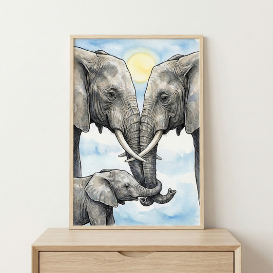 A framed watercolor-style illustration shows an elephant family against a soft blue sky with a pale yellow sun. Two adult elephants face each other with their tusks crossed and trunks intertwined. Below them, a small elephant calf stands and reaches its trunk toward the adults. The artwork is housed in a light wood frame and sits atop a matching wooden dresser.