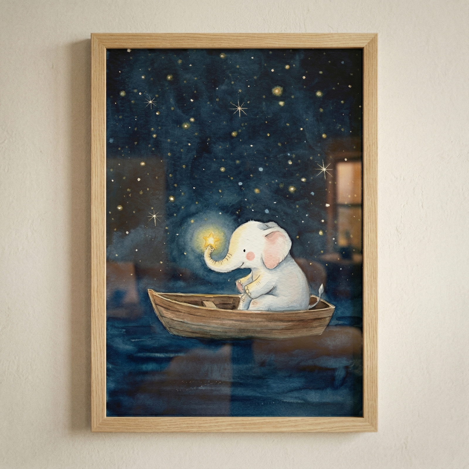 A framed illustration depicts a small, gentle white elephant with pink ears sitting in a simple wooden rowboat. The boat floats on dark, calm water under a deep indigo night sky filled with numerous twinkling stars. The elephant uses its trunk to carefully hold one brightly glowing yellow star. The artwork has a whimsical and soft watercolor style and is housed in a light-toned wooden frame, hanging on a neutral-toned wall.