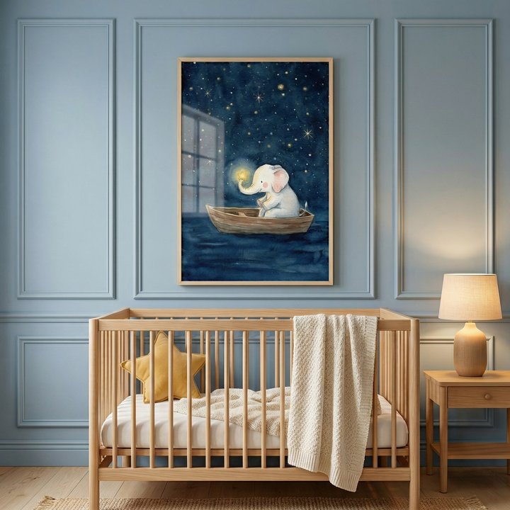 A peaceful nursery with blue paneled walls and a light wood crib. Inside the crib are a white mattress, a yellow star-shaped pillow, and a cream knit blanket. Above it, framed artwork depicts a small white elephant in a wooden boat on dark water under a starry sky, holding a glowing light. To the right, a wooden nightstand holds a lamp with a warm glow. The room features light wood floors and a textured rug, creating a cozy atmosphere.