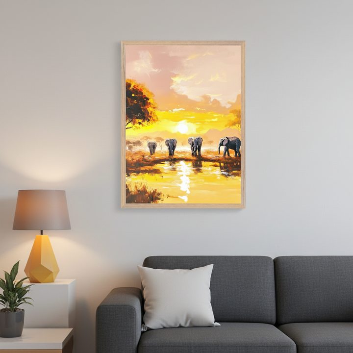 Modern living room with a dark gray sofa, white side table, and lamp. A framed painting of five elephants by a watering hole at a vivid yellow sunset hangs above the sofa.