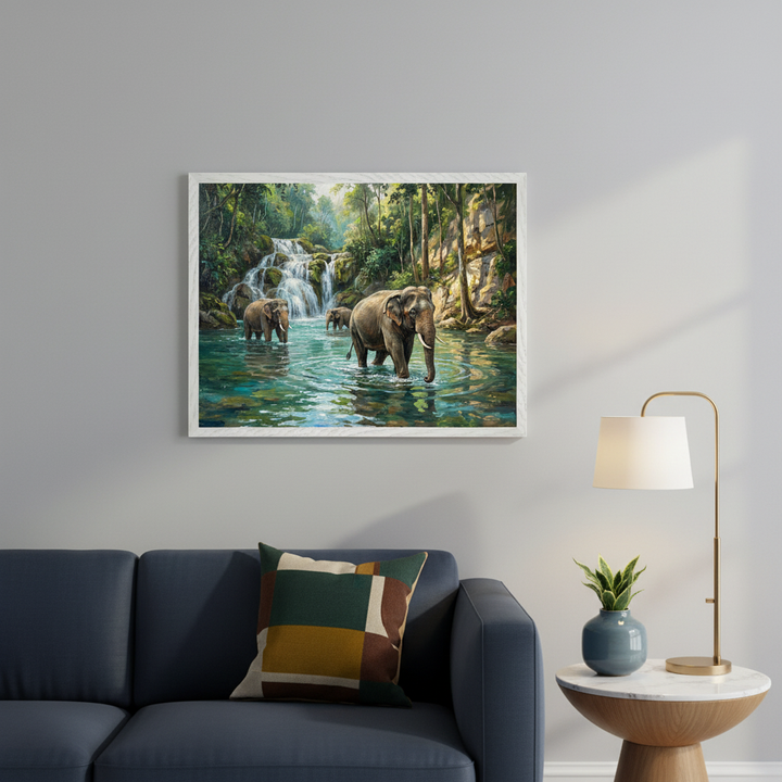 Modern bedroom with a gray upholstered bed, white pillows, and bedding. A large framed painting of three elephants wading in a river with a waterfall and lush jungle hangs centered above the bed.