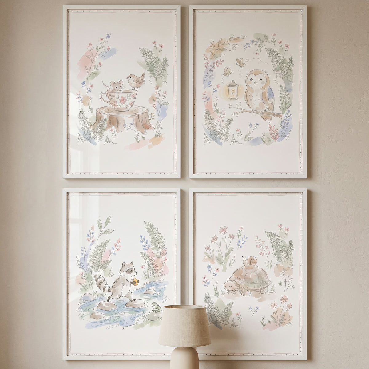 Enchanted nature forest animal wall art set of 4 watercolor illustrations of woodland creatures in white frames on a wall.