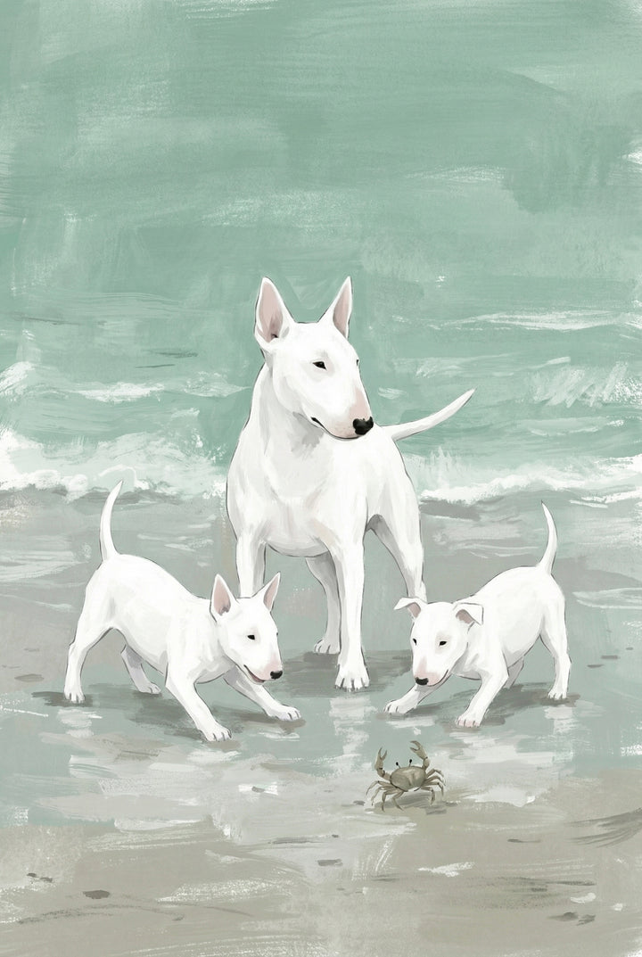 Two curious bull terrier puppies cautiously approach a crab on the wet sand, while the adult dog watches calmly nearby. The gentle sea background sets a relaxed coastal mood.
