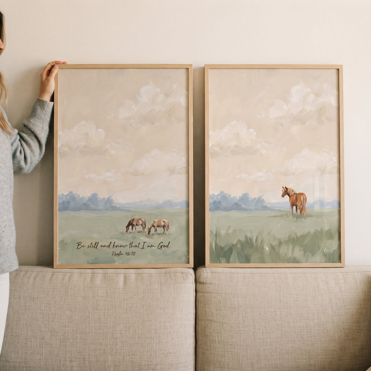 A woman holds an equestrian heritage brown horse wall art set of 2 depicting horses and Psalm 46:10 scripture verse.