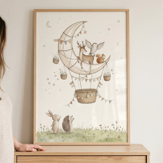 Ethereal moon balloon animals wall art depicts a deer, owl, and squirrel on a crescent moon above a rabbit and hedgehog.