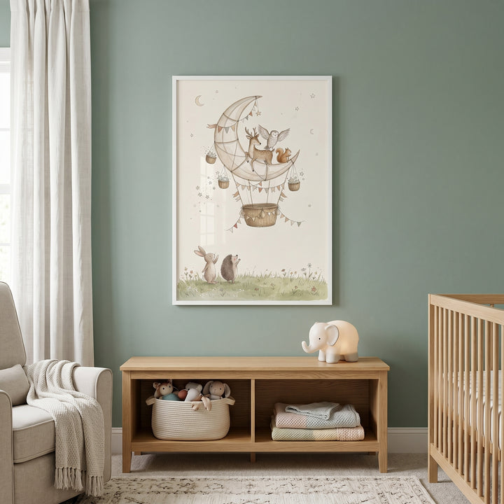 Ethereal moon balloon animals wall art hangs on a sage green nursery wall above a wooden shelf and elephant lamp.