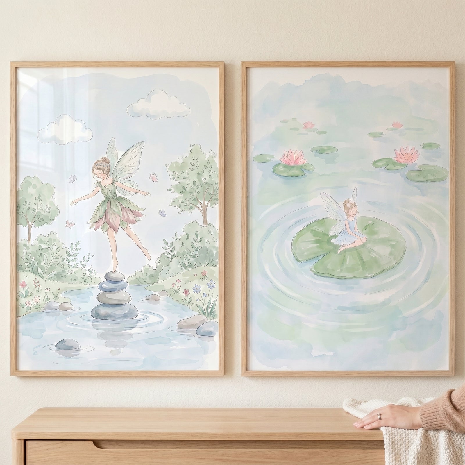 Ethereal watercolor pastel fairy wall art set of 2 depicts winged figures in soft pond and nature scenes above a dresser.