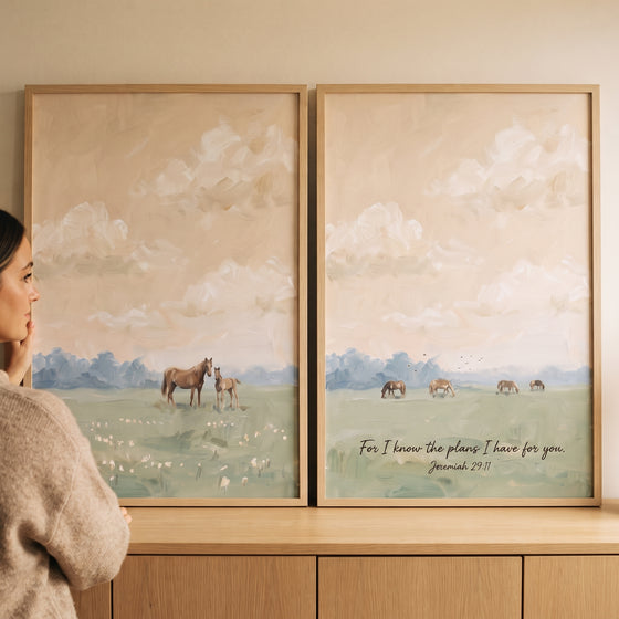 European farmhouse meadow horse wall art set of 2 with horses in a field under a cloudy sky and a Bible verse.