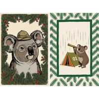 Set of two whimsical wall art prints featuring koalas with an outdoorsy forest theme. One print shows a close up koala wearing a safari hat and framed by pine branches and red berries. The other shows a koala looking through a telescope beside a green tent marked "01" inside a border of pine leaves.
