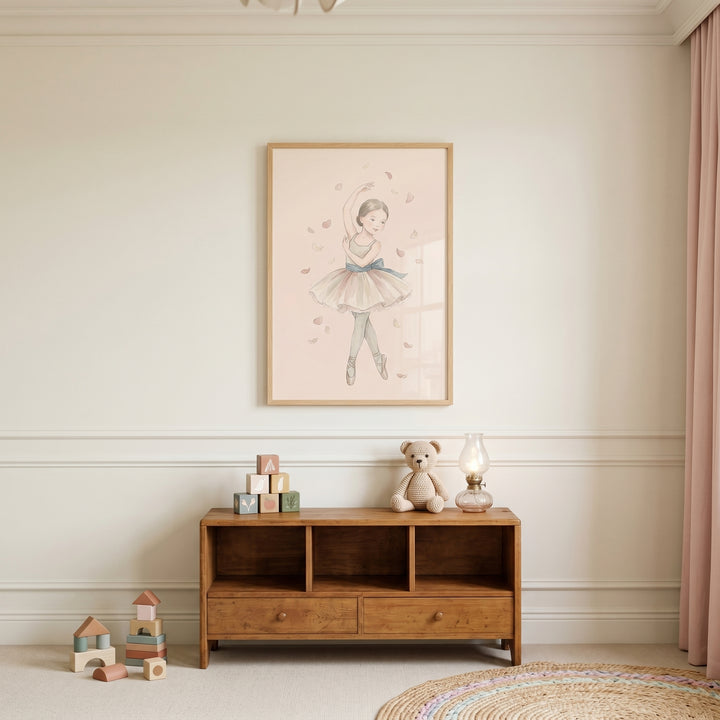 Falling petal watercolor ballerina wall art hangs above a wooden cabinet with a teddy bear and blocks in a nursery.