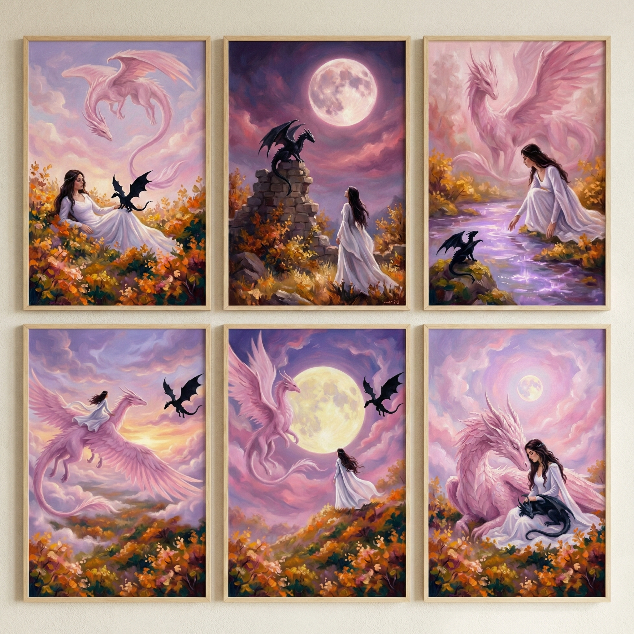 A series of six framed fantasy illustrations are arranged in a two-by-three grid against a neutral wall. The collection features a consistent theme centered on a woman with long dark hair wearing a flowing white gown, interacting with a large pink winged creature and smaller black dragon-like beings. The style uses soft, ethereal colors like pastel purples, pinks, and golden yellows, often set under a large, glowing moon.

