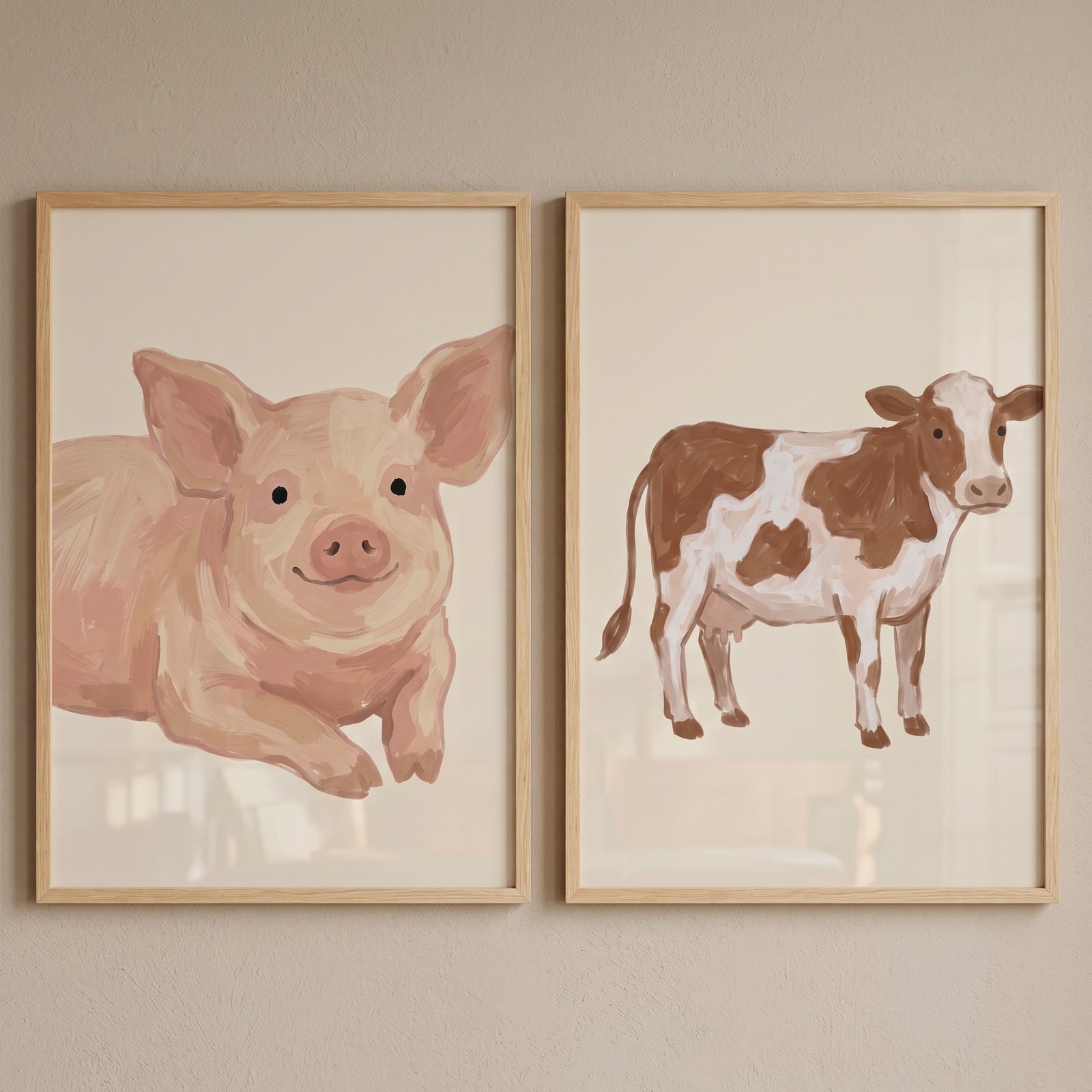Farm animals wall art set of 2 featuring a pink pig and a brown and white cow in light wood frames.